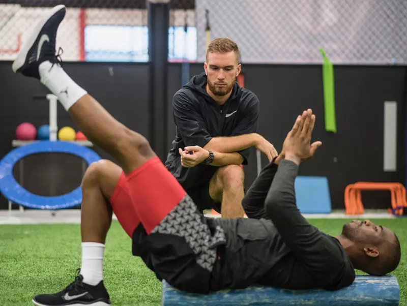 Matt coaching Chris Paul through a floor exercise